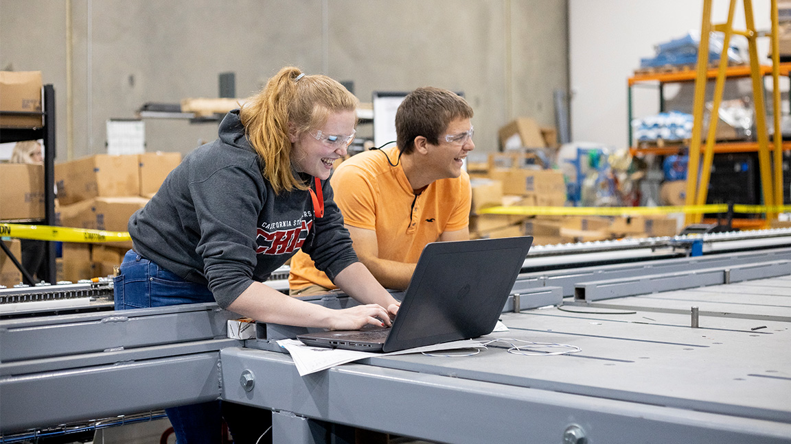 Two students working on a computer
