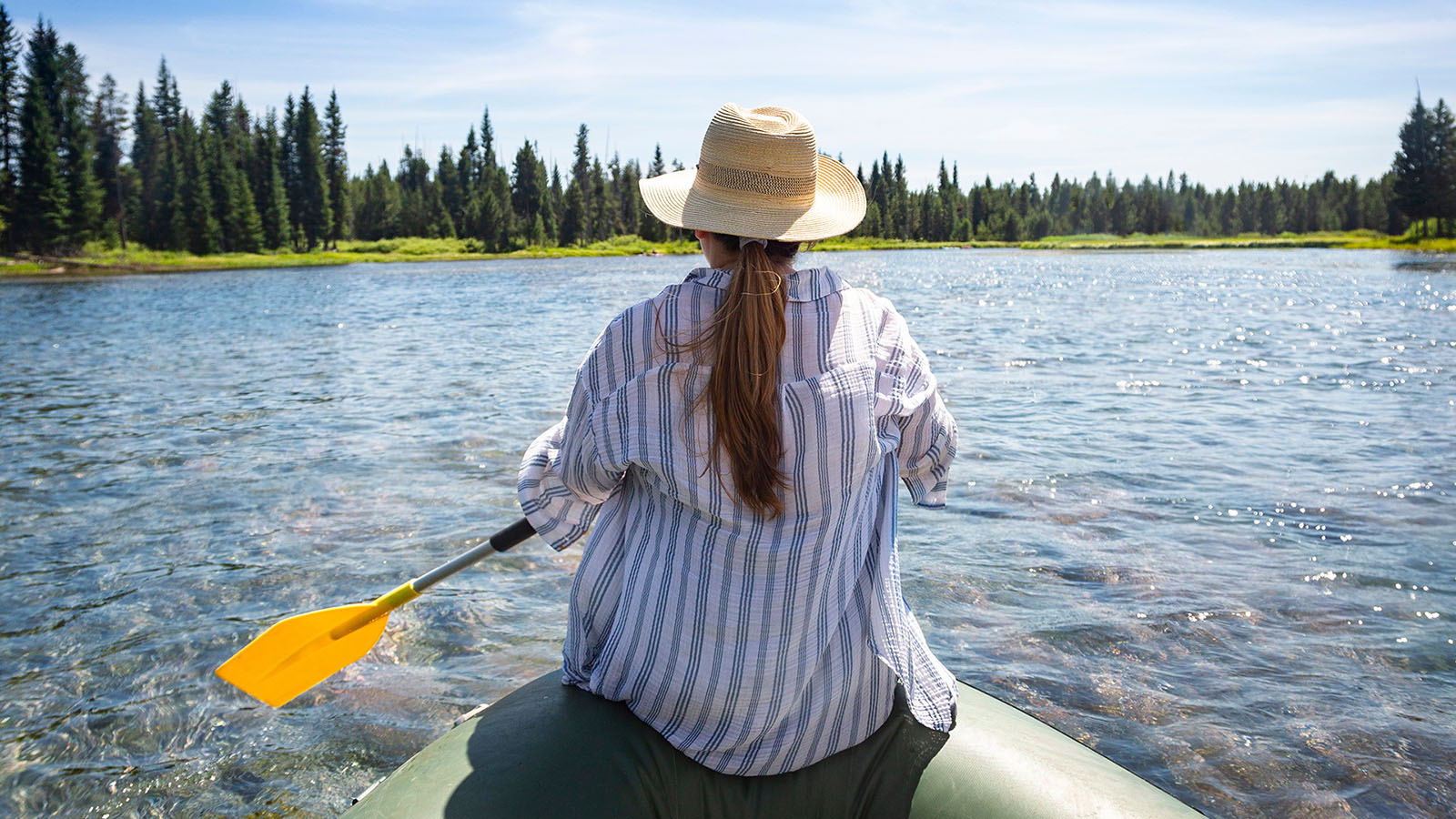 Woman using a canoe in Idaho