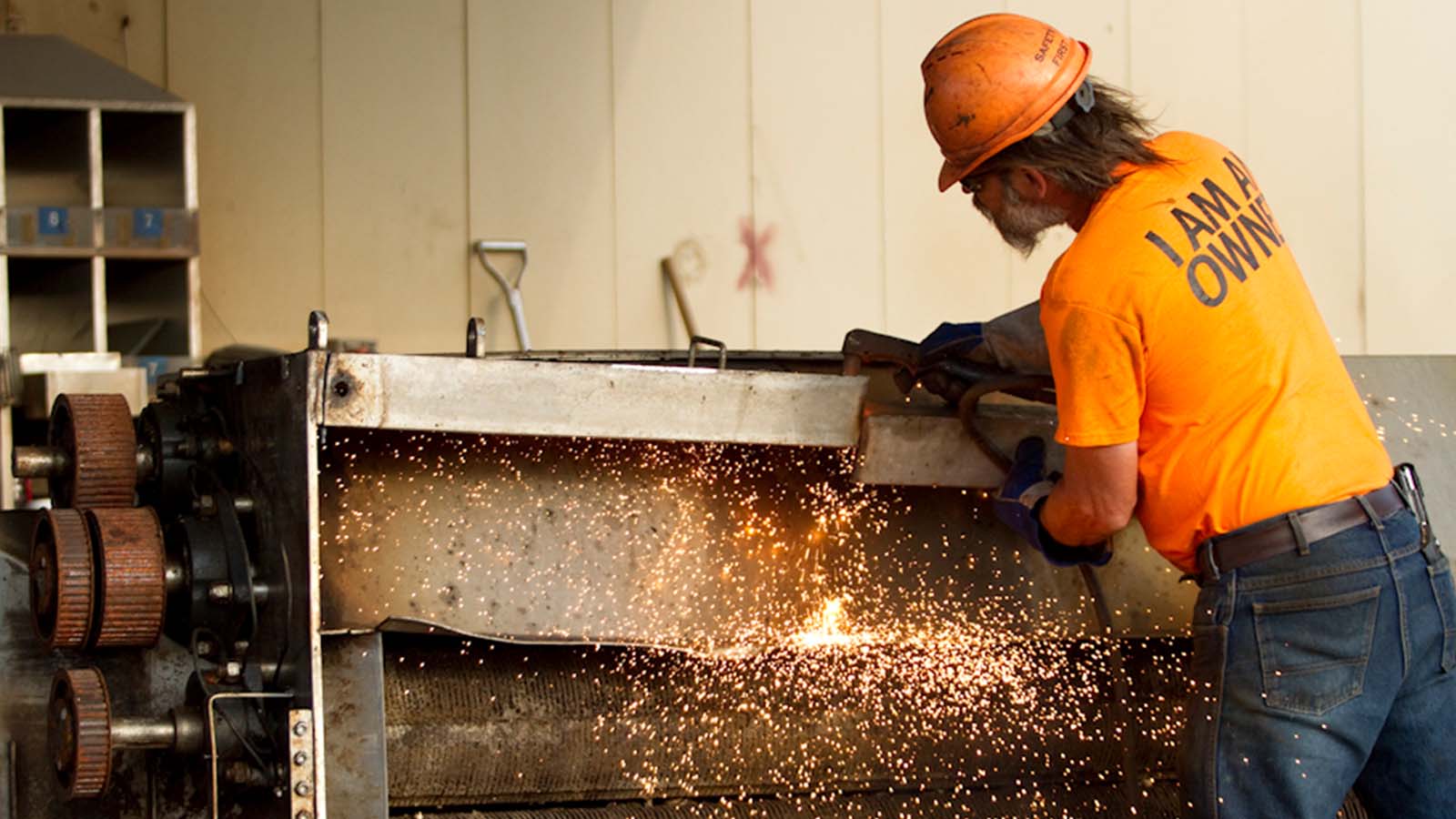 A business owner welds